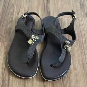 MK Stylish Black Sandals with Charm Accents